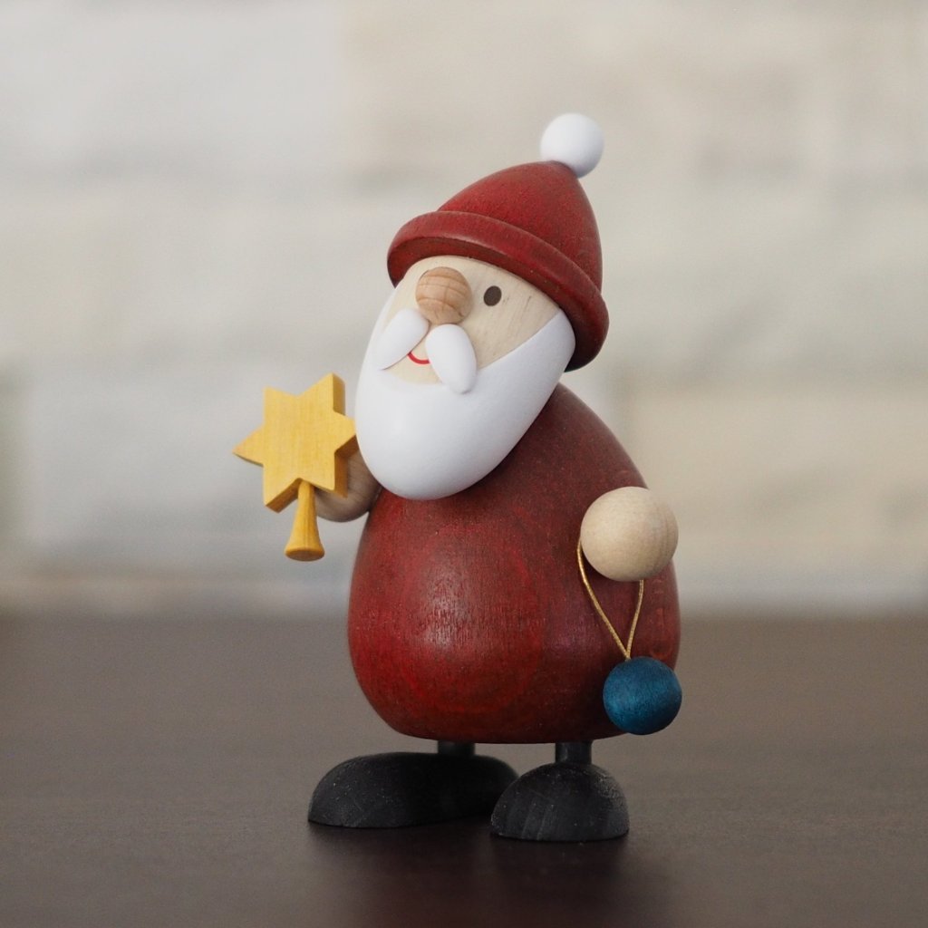 Weihnachtsmann Collectibles - Santa topping his Tree